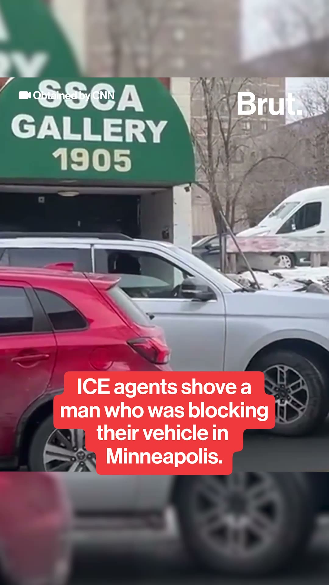 ICE agent shoves man in Minneapolis.