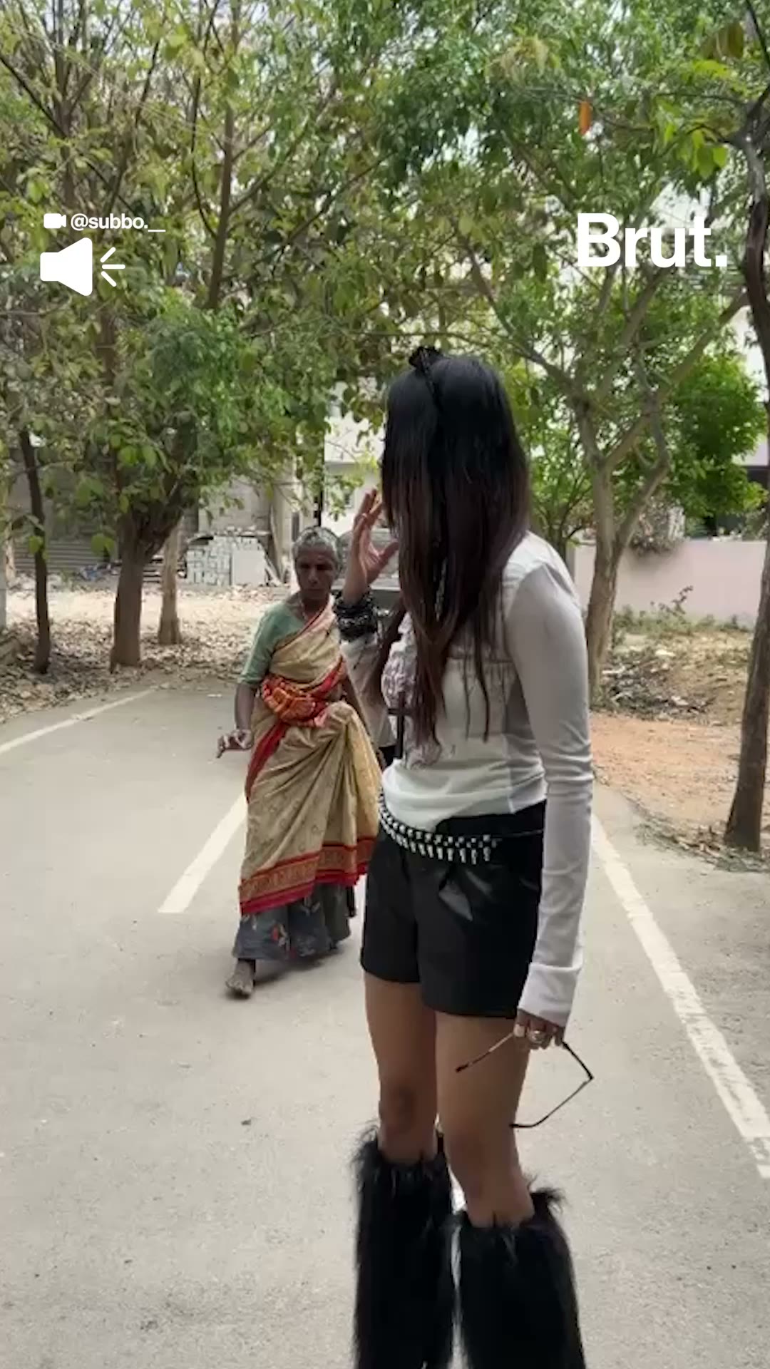 Young woman scolded by elderly woman over her outfit