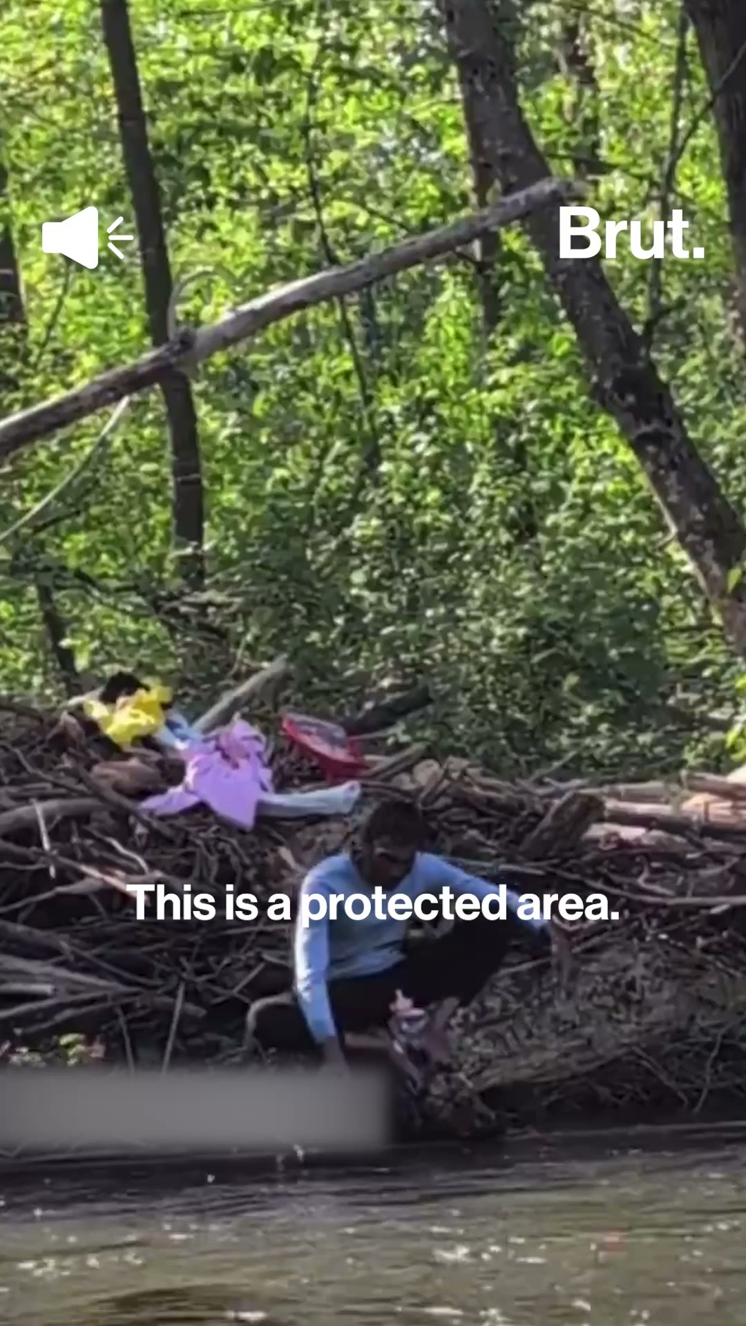 Man washes clothes in river in Canada: