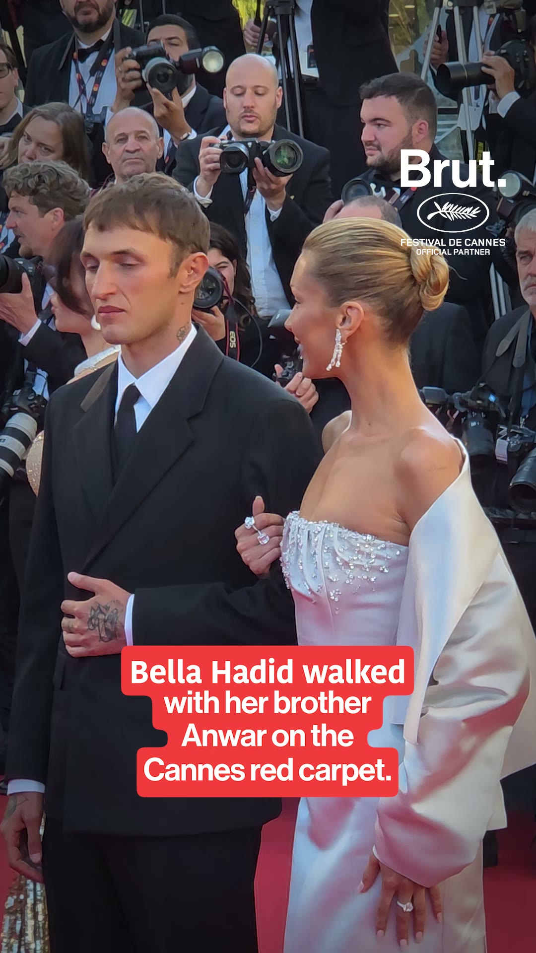 Bella Hadid walks hand in hand with her brother on the #cannes2026 red carpet.