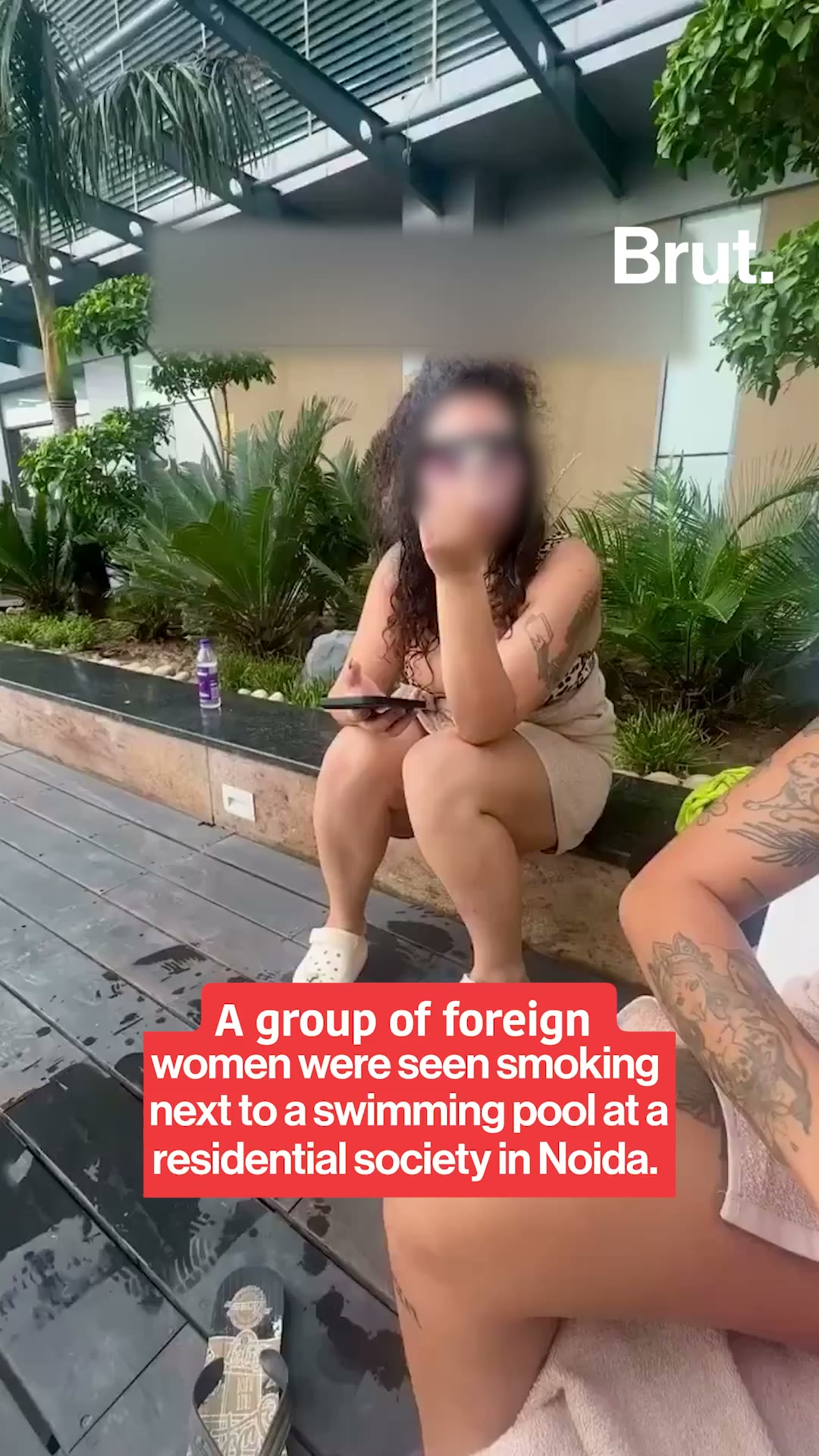 Foreign women allegedly smoking marijuana next to a pool in Noida society