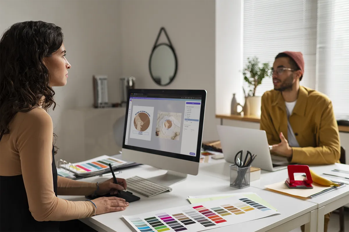 Two eCommerce consultants using Customily personalization platform in an agency office setup.