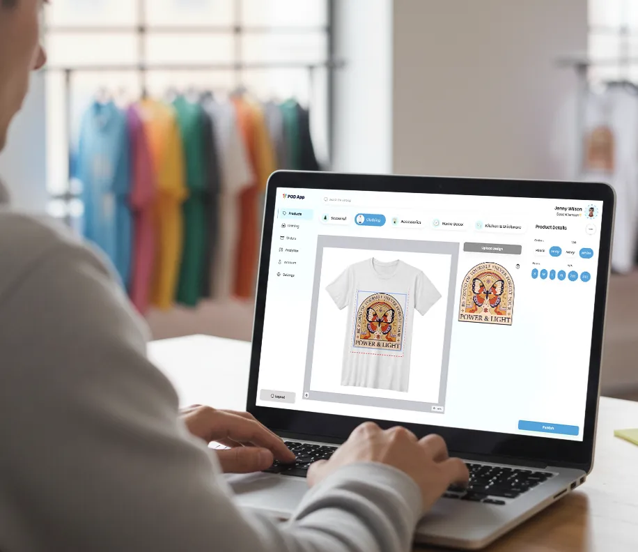 Merchant applying artwork on a t-shirt using a Print-on-Demand platform powered by Customily.