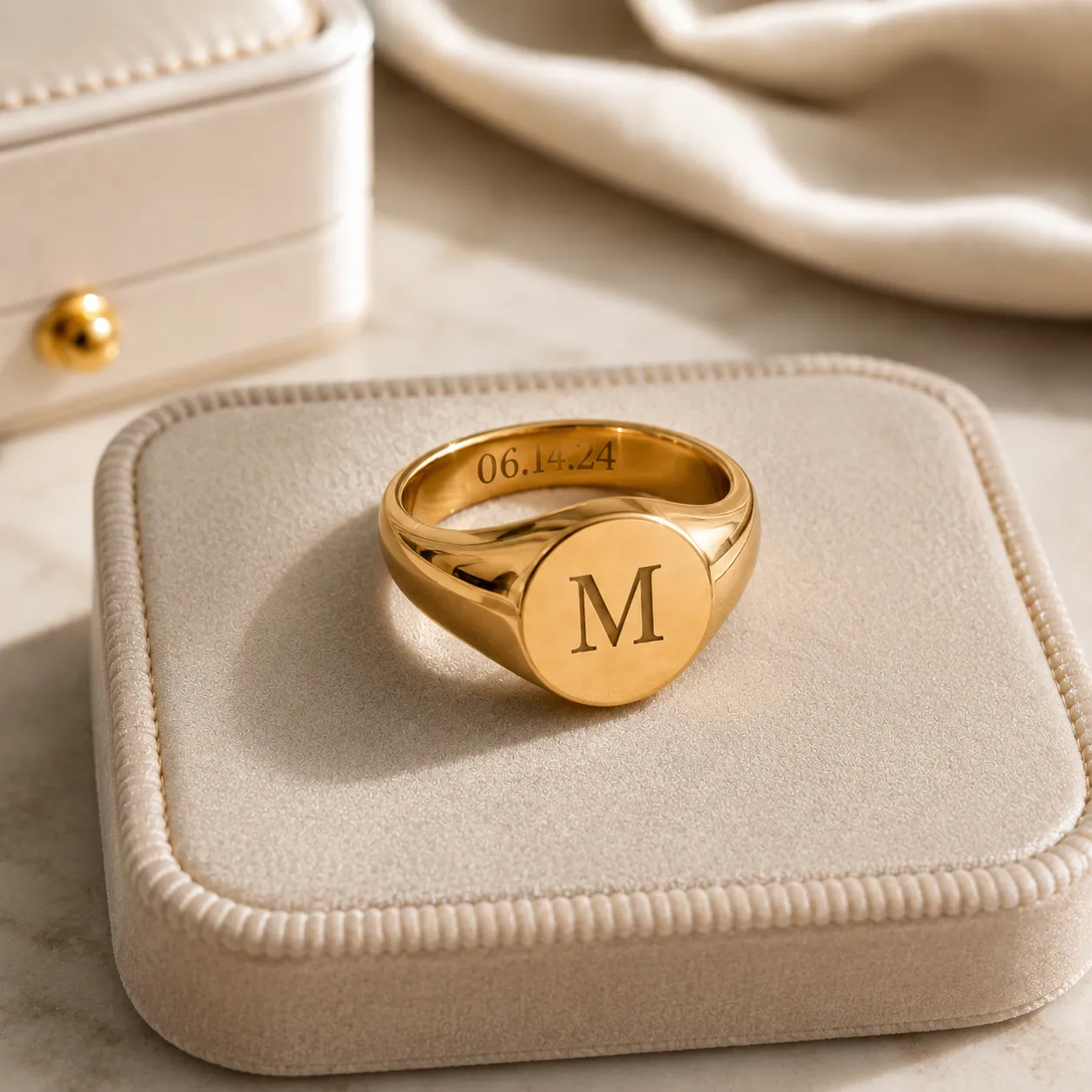 Personalized signet ring engraved with a custom initial and date.