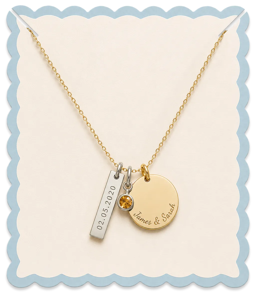 Personalized charm necklace with engraved date, birthstone, and name charms