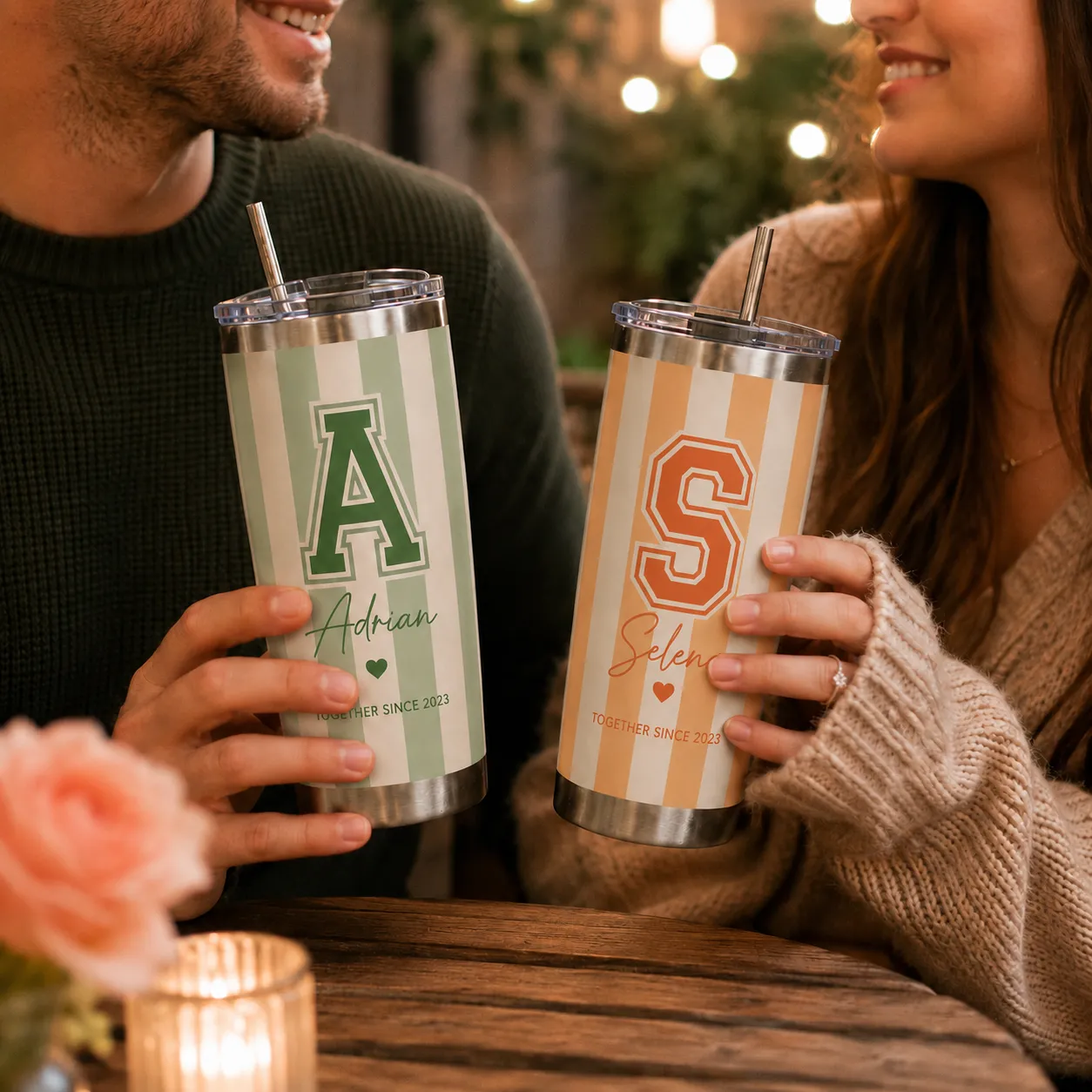 Couple holding personalized tumblers with custom monograms, names, and anniversary date.