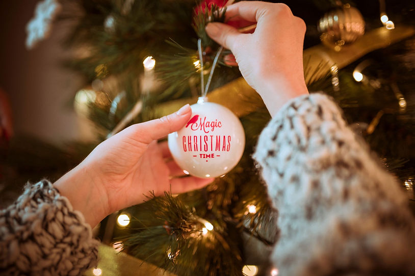 Hands holding a Christmas ornament