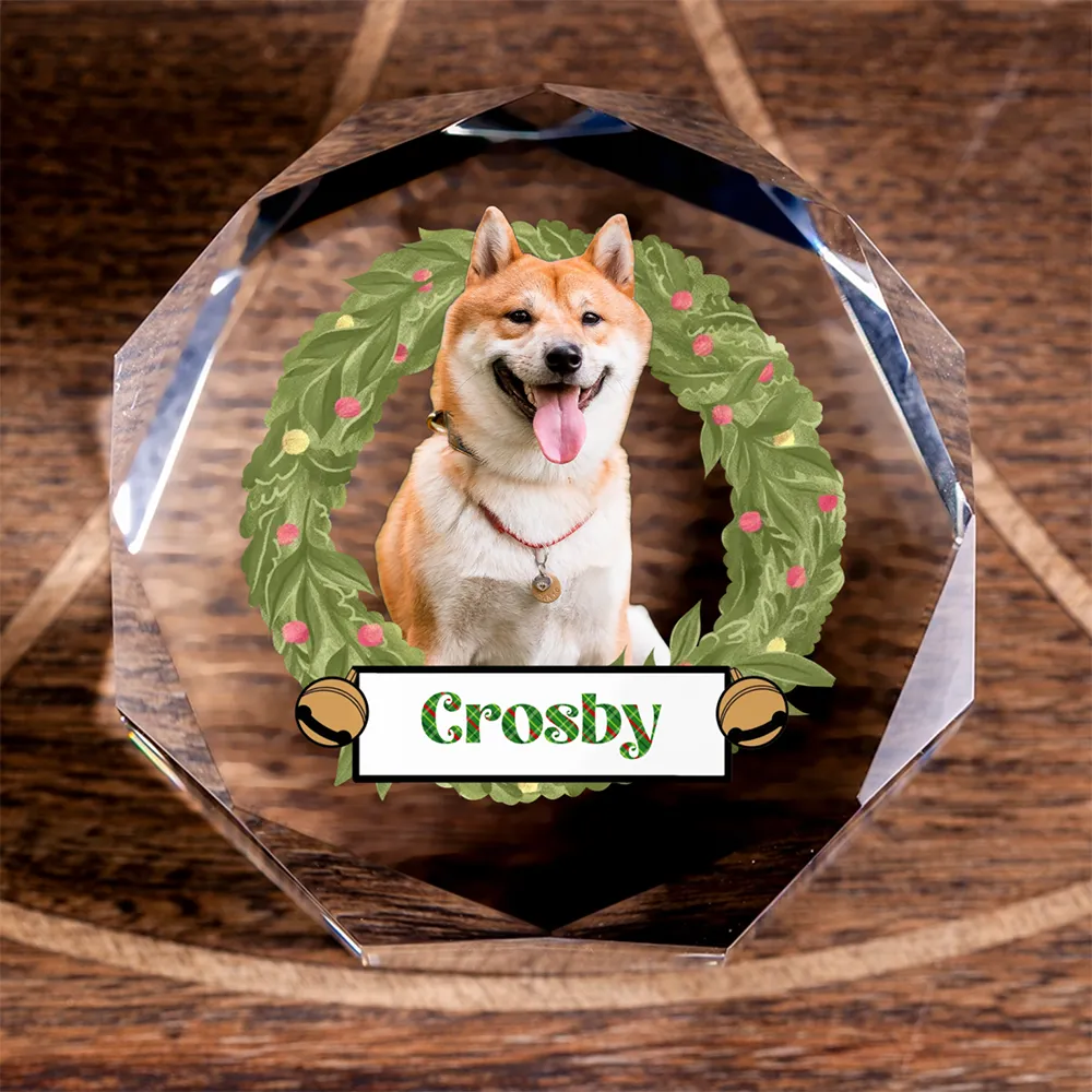 Customized faceted crystal puck with a dog photo and Christmas wreath design, ideal as a personalized holiday gift.