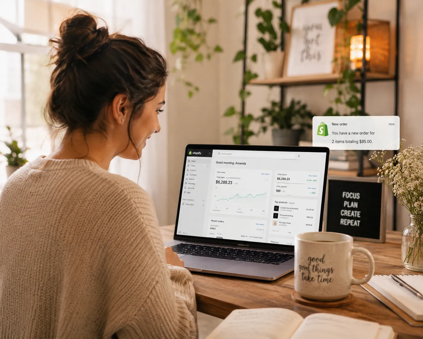 Girl on her notebook receiving orders on shopify store