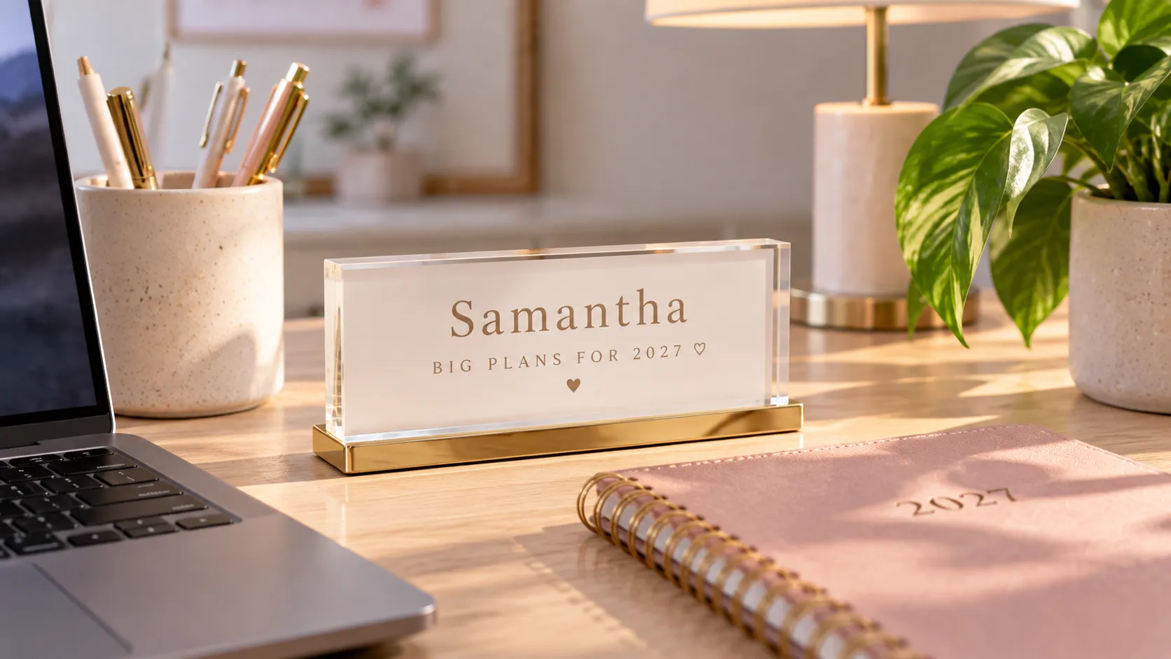 A desk with a personalized acrylic name and a personalized journal