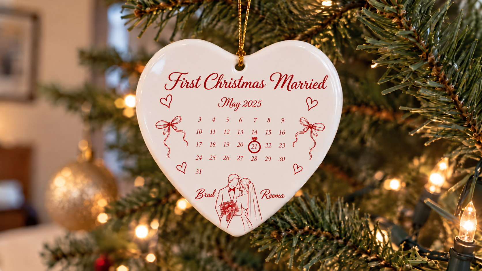 Personalized heart-shaped Christmas ornament with wedding date calendar and couple's names.