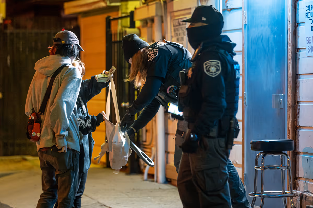 Two security guards outside a bar in Sacramento.