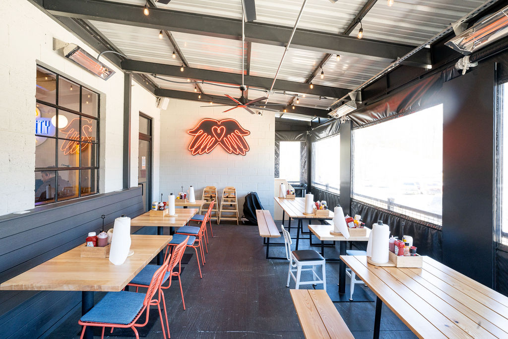 Community Burger at The Mill in Canton, GA, fuses retro warmth with industrial edge, crafting a bold, inviting space that sparks connection and conversation.