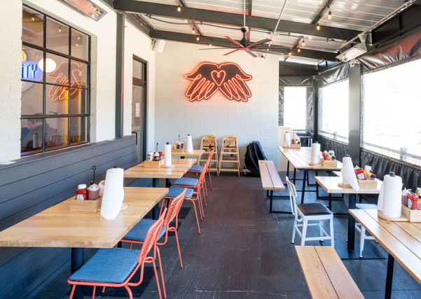 Community Burger at The Mill in Canton, GA, fuses retro warmth with industrial edge, crafting a bold, inviting space that sparks connection and conversation.