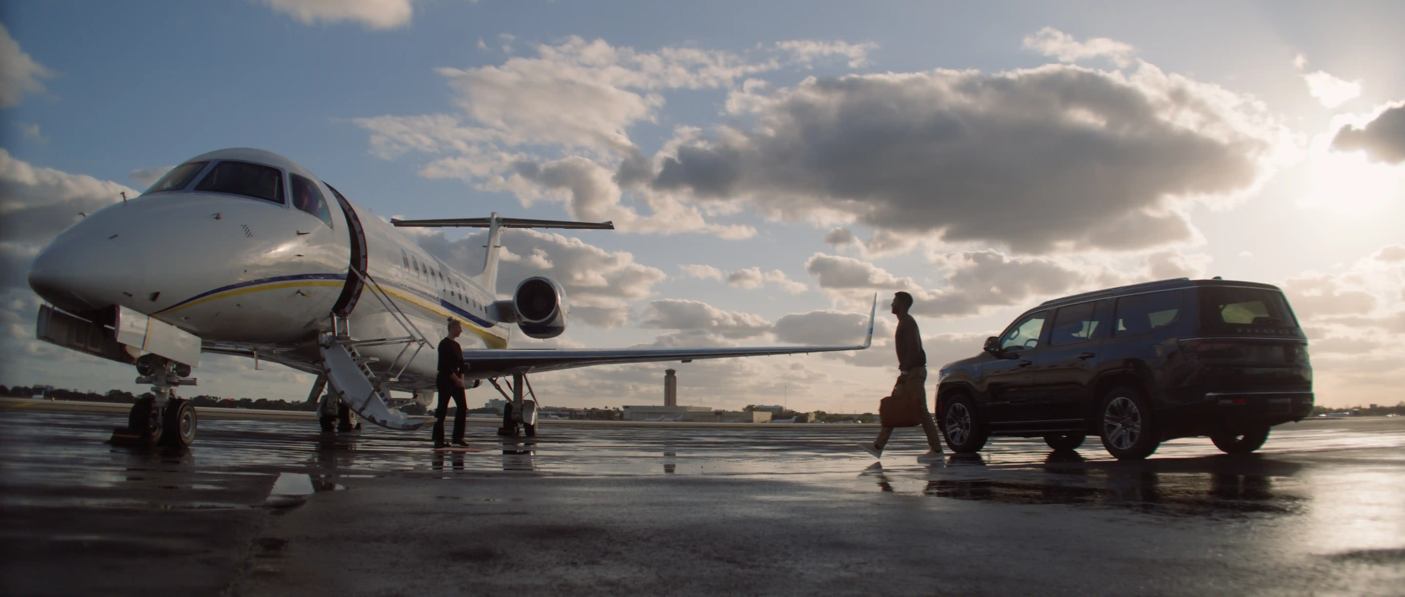 private jet and black suv on a runway at sunset, Jets.com commercial