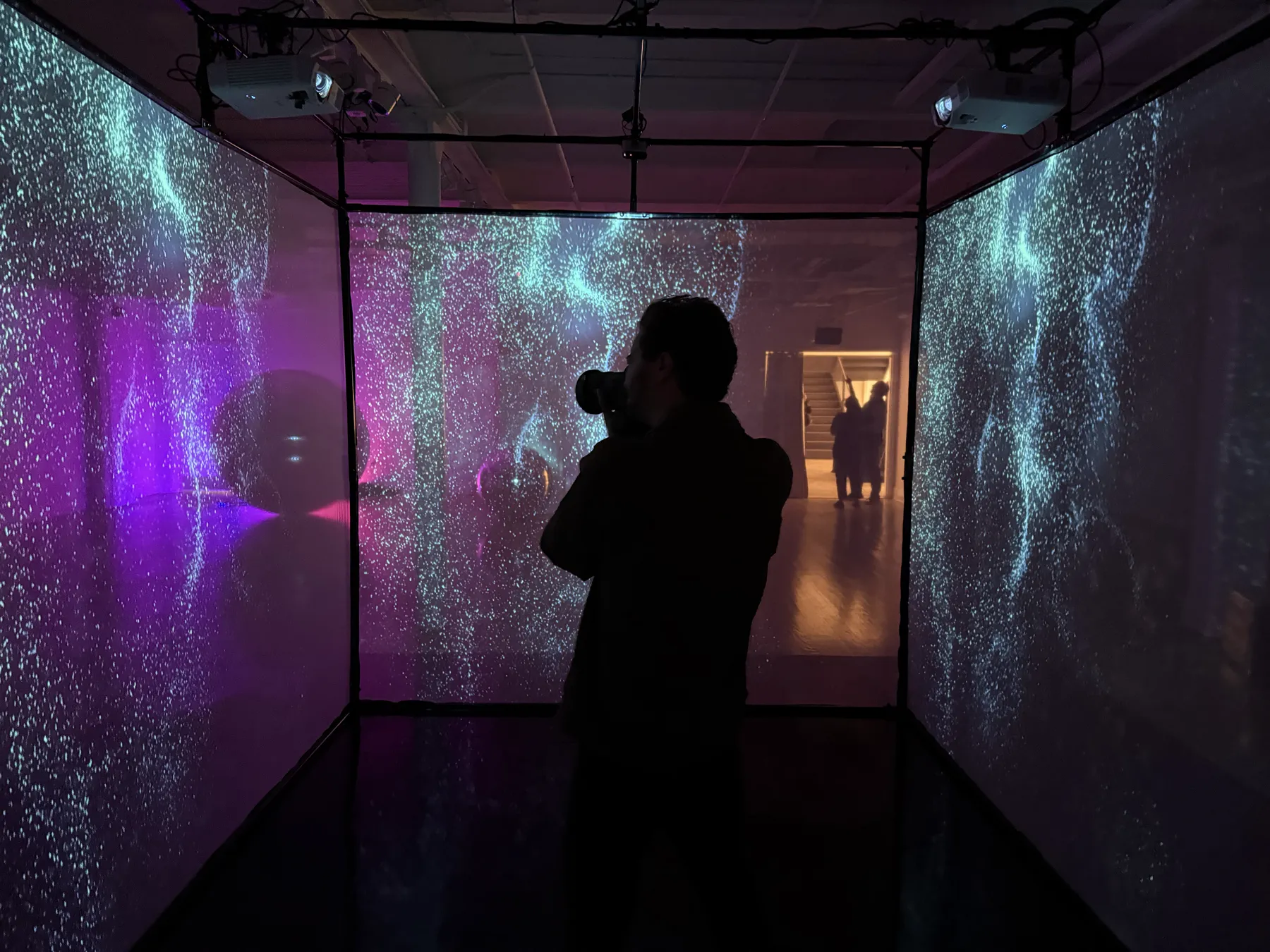 guest filming inside the projection cube