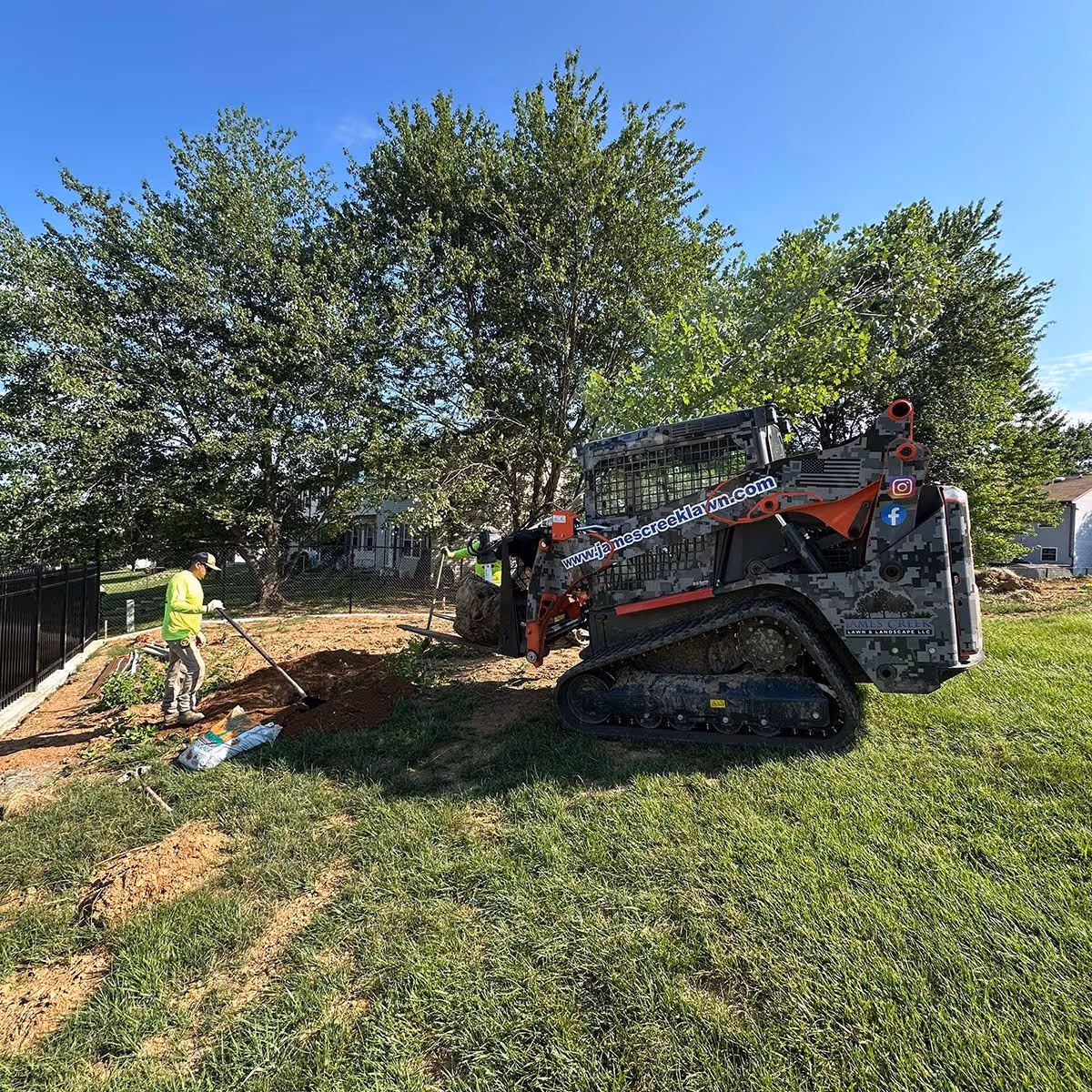 Skid steer grading work by James Creek Lawn and Landscape
