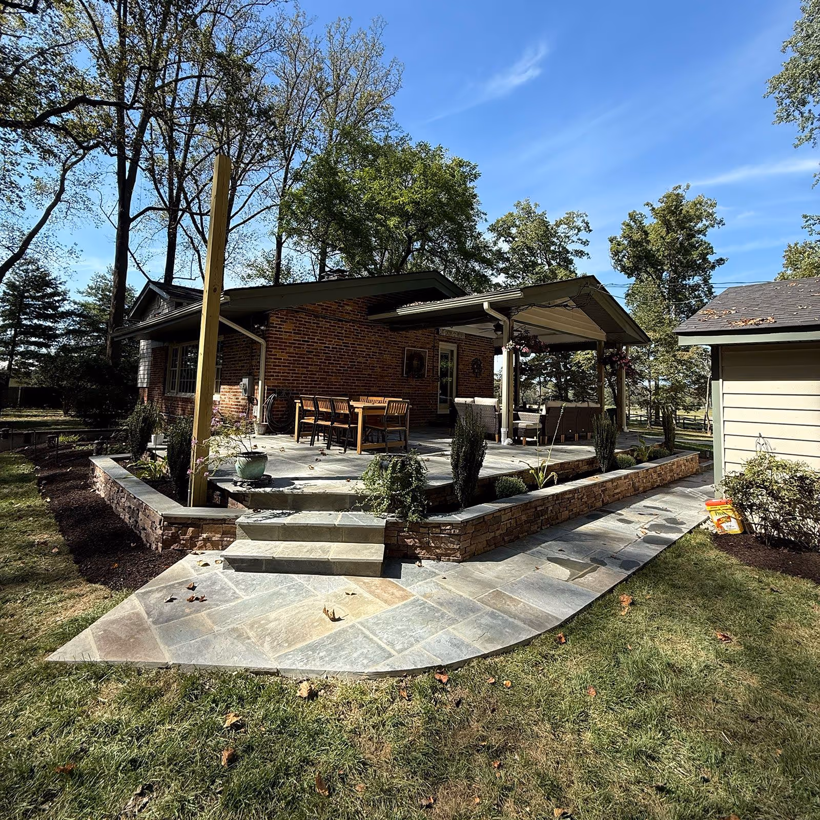 Custom stone patio and walkway near me by James Creek Lawn and Landscape