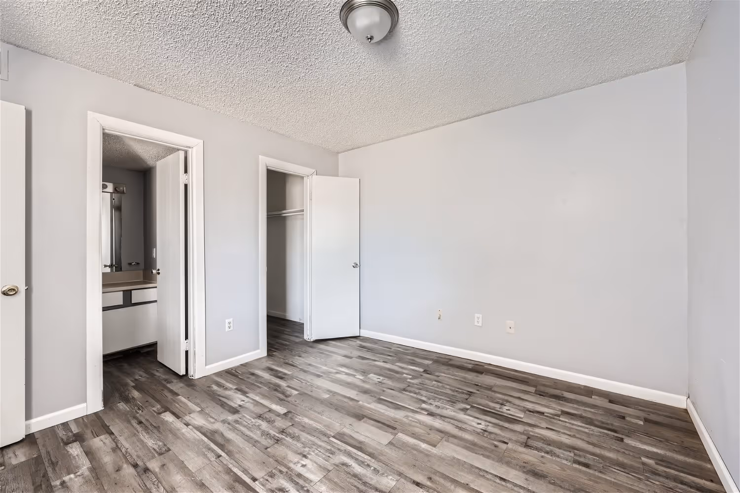 Empty bedroom with wood flooring