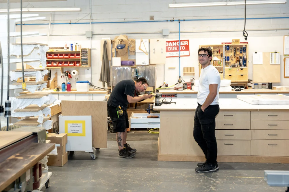 Two Clay team members working in the shop 