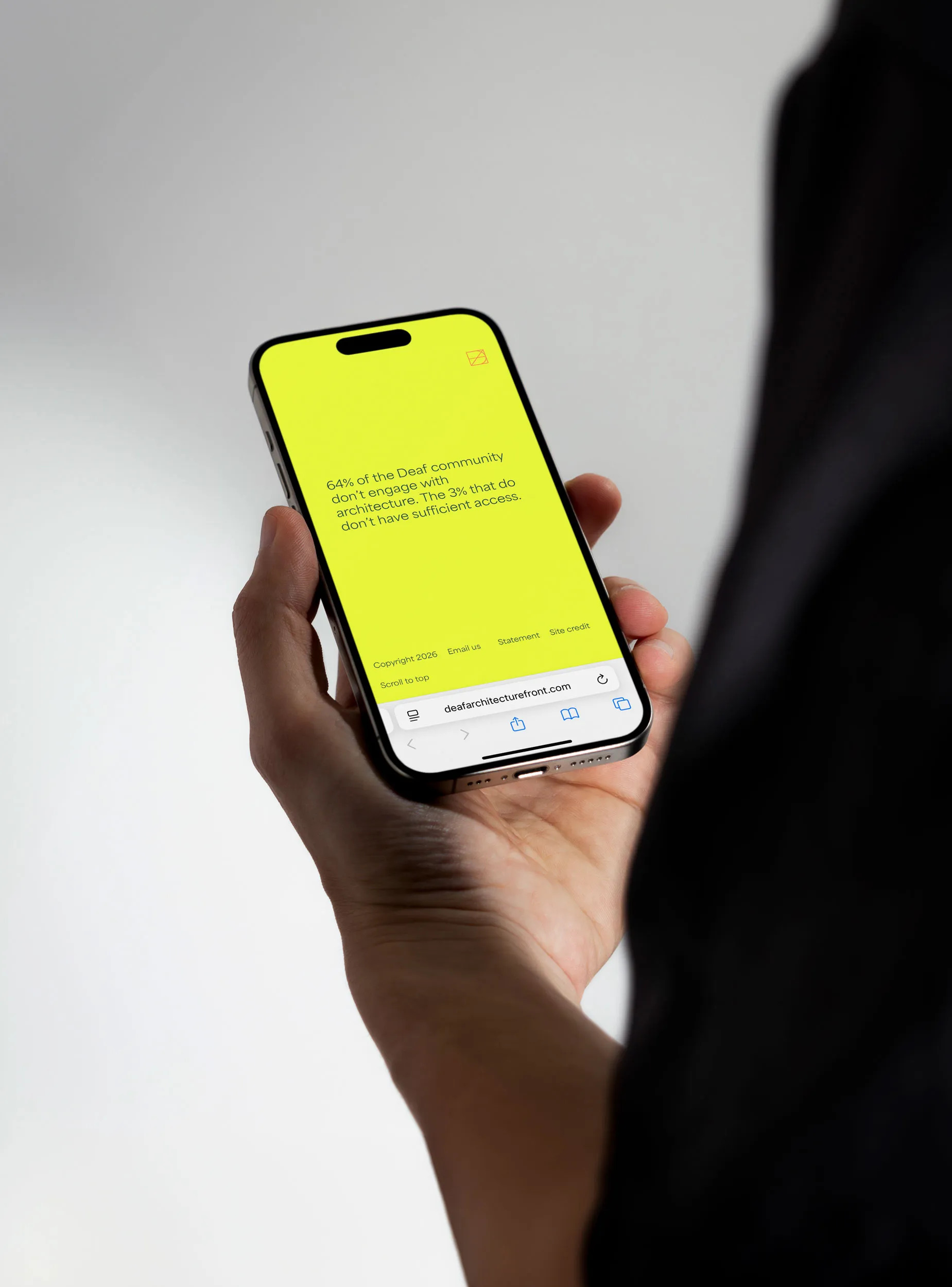 iPhone mockup displaying the mobile version of the Deaf Architecture Front website.