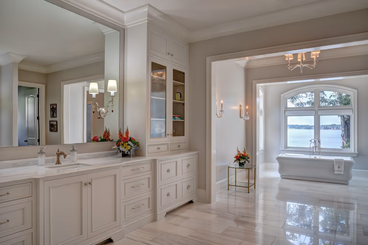 Serene master ensuite featuring a deep soaking tub, glass‑door steam shower, and natural stone accent wall