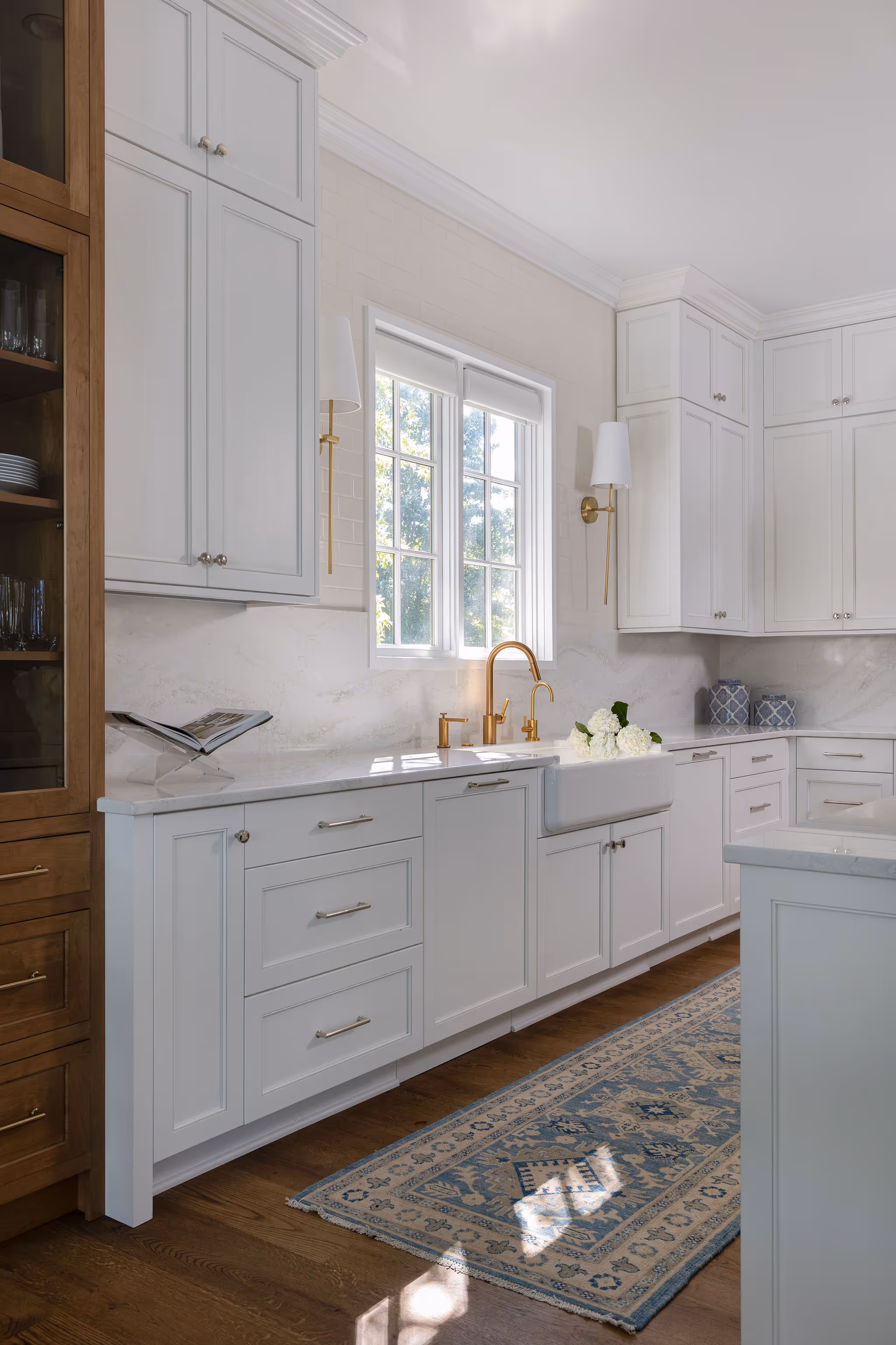 Modern white cabinetry with gold accents