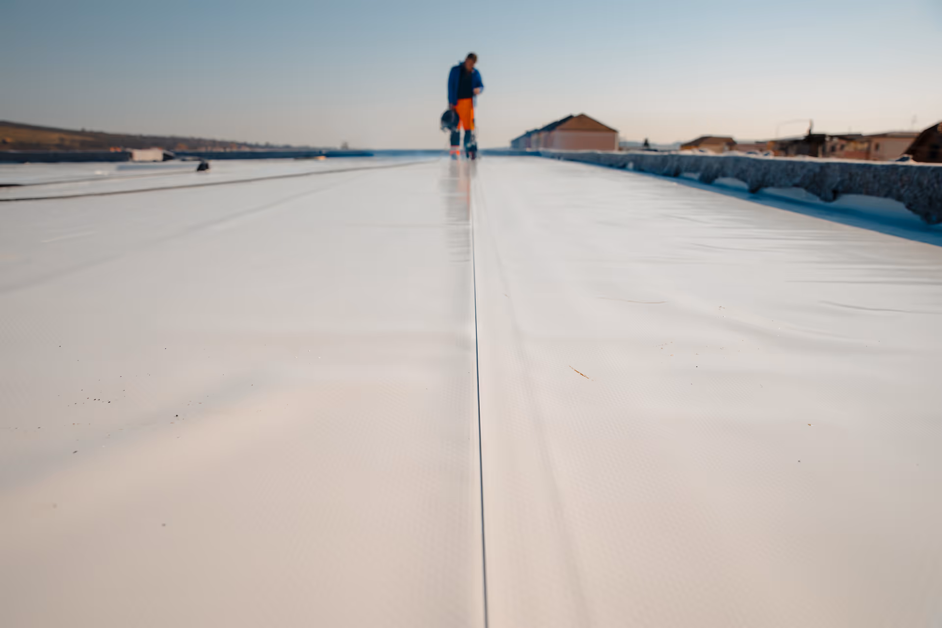 waterproofing roof application at a construction site