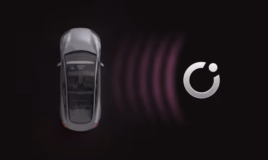 Top view of a silver car with purple radar waves emitting from the front towards a round sensor icon.