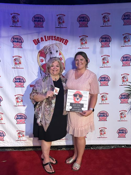 The Keys Pet Nanny family poses with a sponsorship award during a Marrvelous Pet Rescue Event.