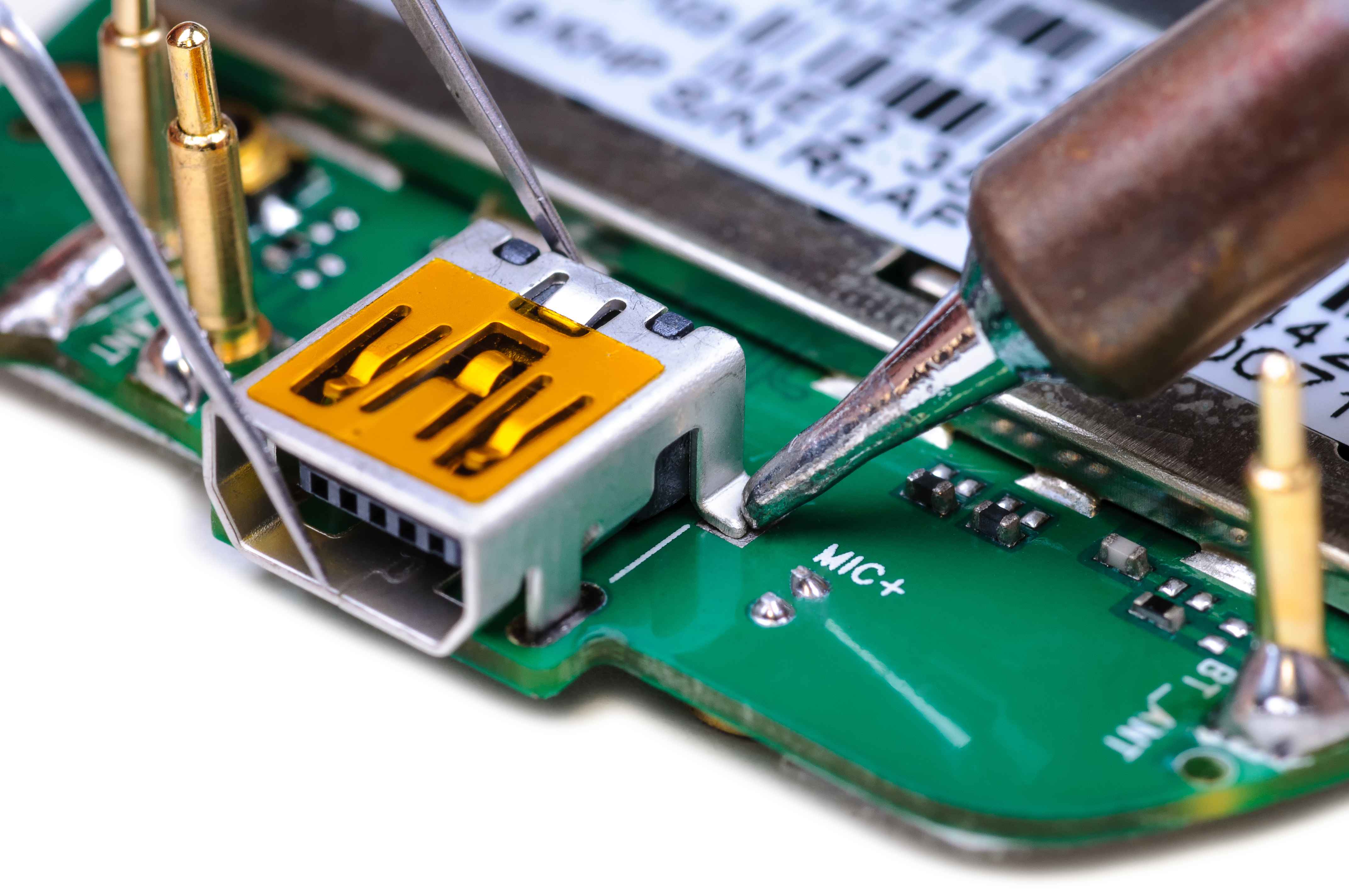 Soldering a USB charging connector onto a circuit board