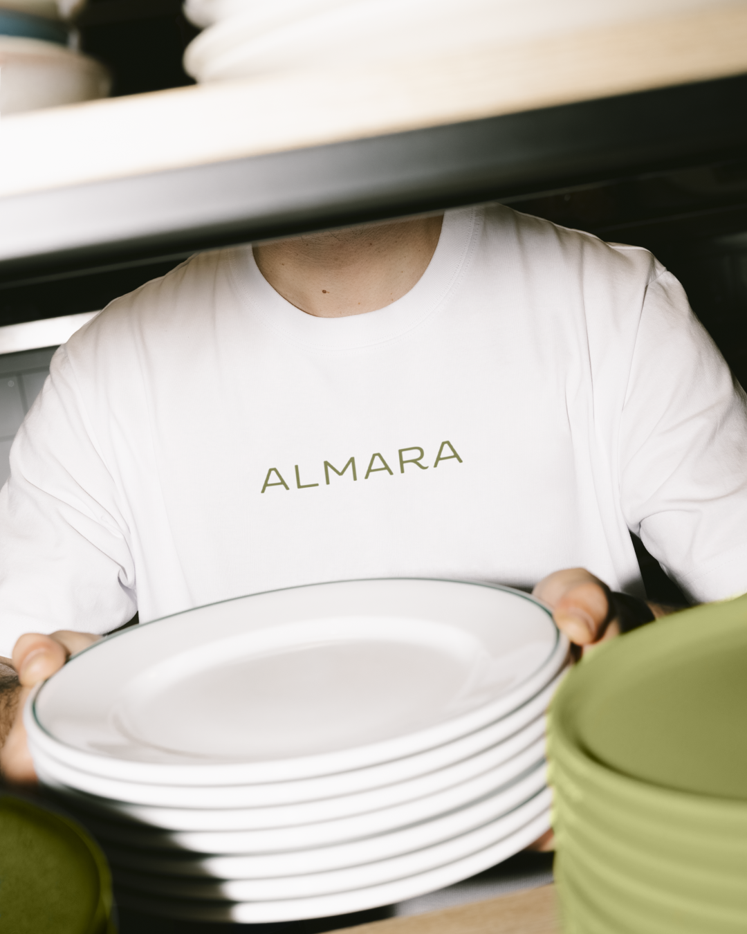 Almara hospitality brand identity applied on restaurant staff uniform