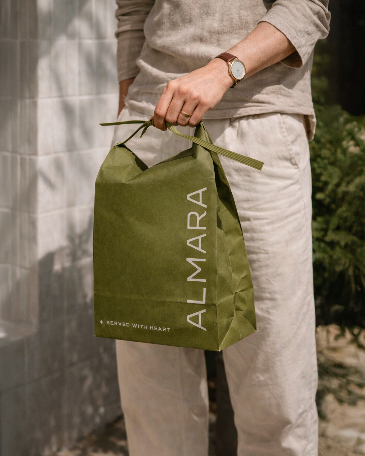 Almara hospitality brand identity applied on restaurant staff uniform
