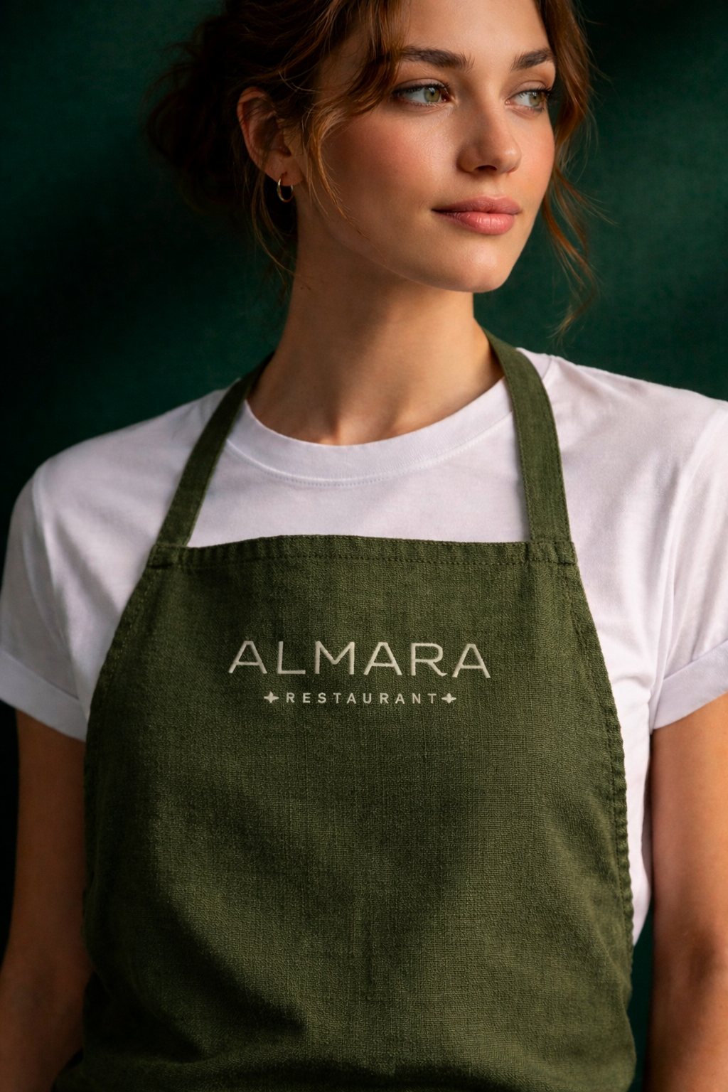 Almara restaurant brand identity applied to staff apron