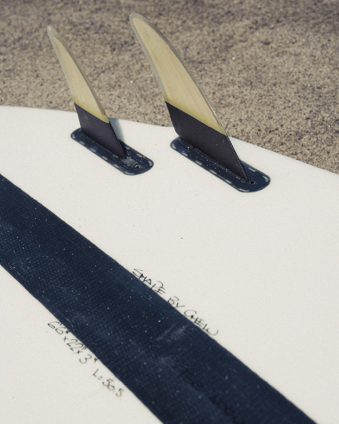 Chelu Surfboards handcrafted surfboard by the beach – surf lifestyle photography