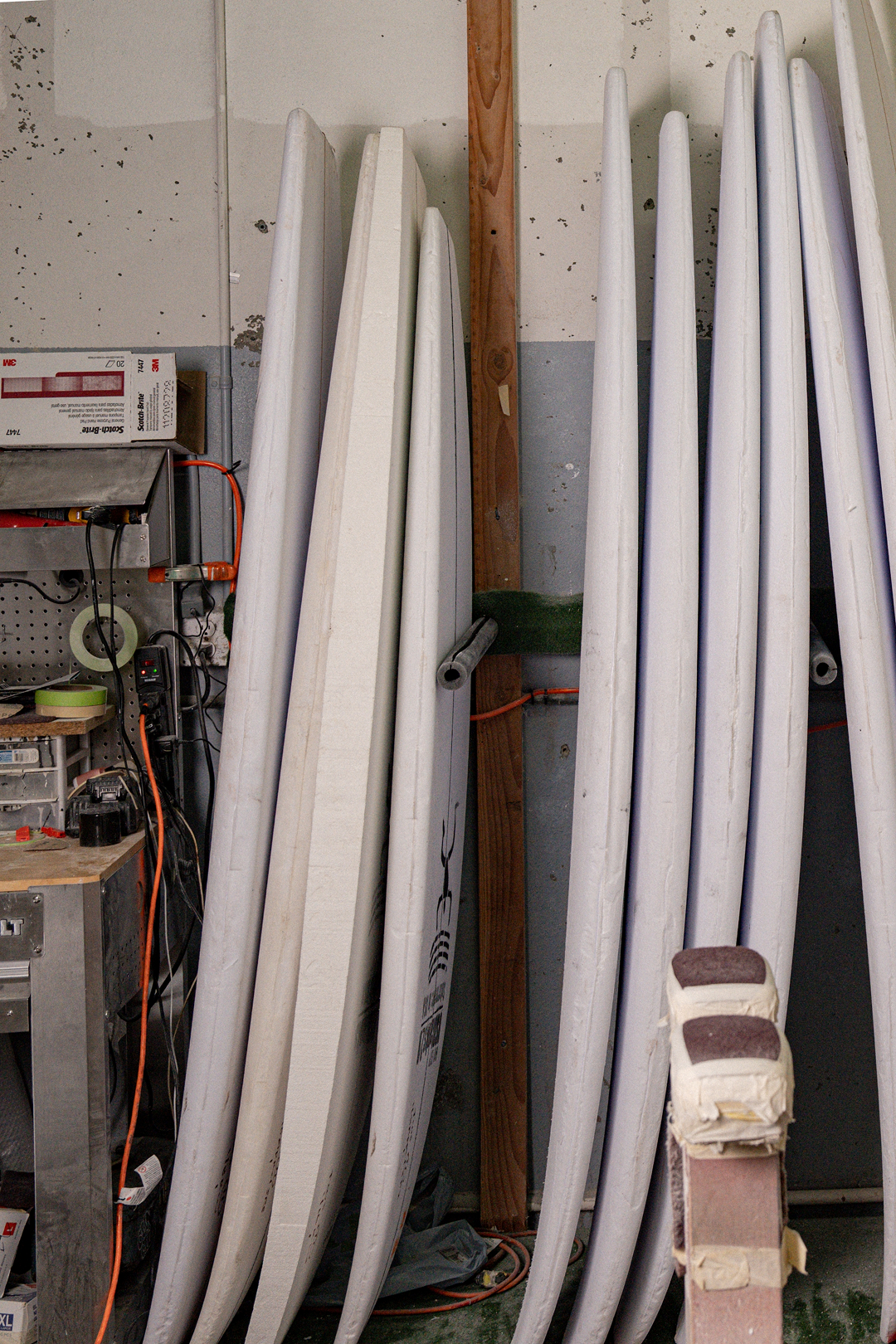 Chelu Surfboards handcrafted surfboard by the beach – surf lifestyle photography