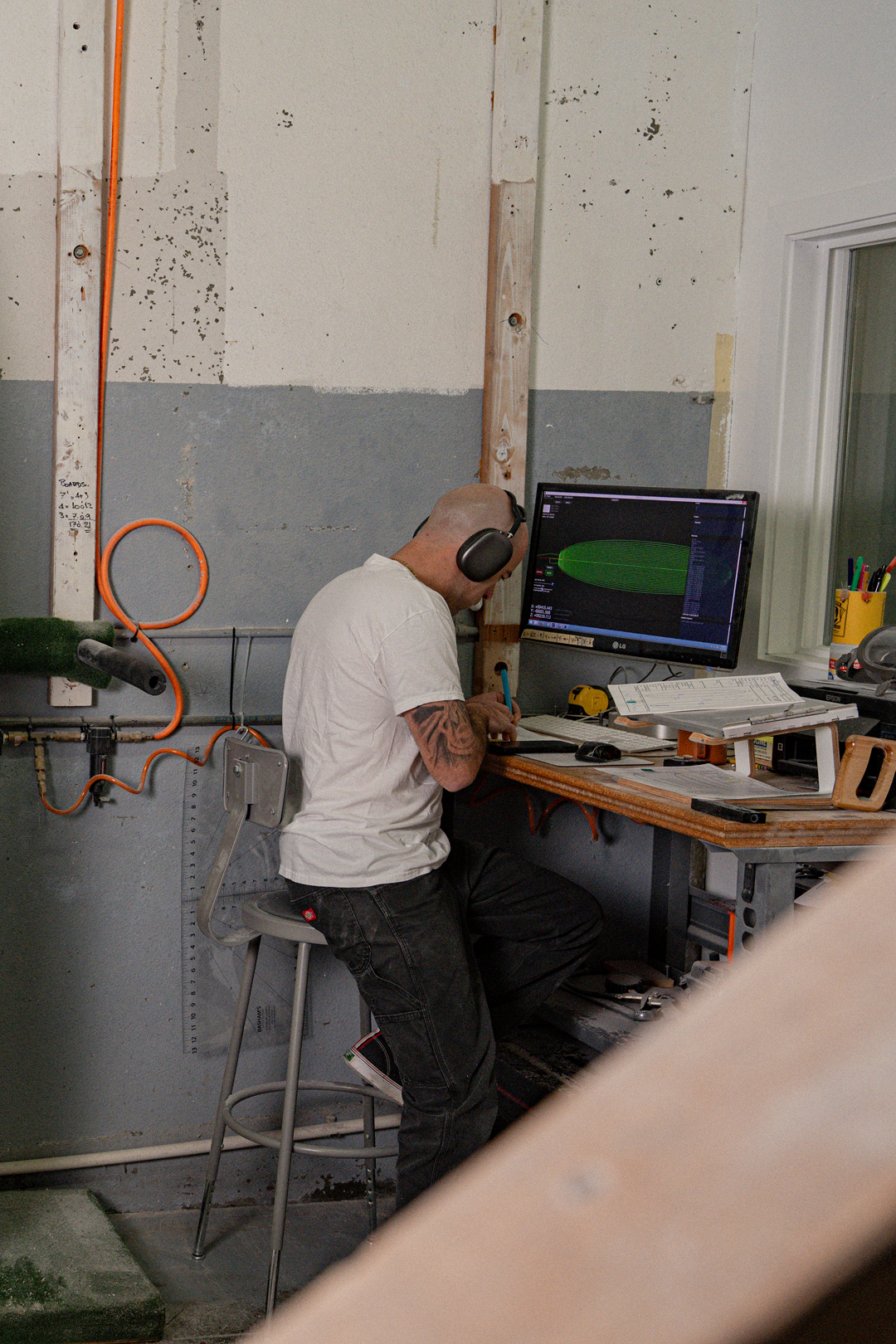 Surfboard design process at Chelu Surfboards workshop using shaping software