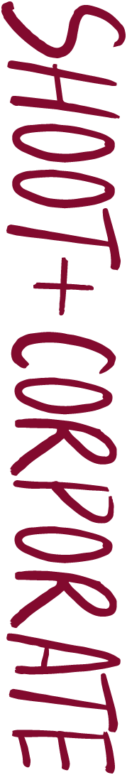 Maroon handwritten text reading 'SHOOT + CORPORATE' on a black vertical background.