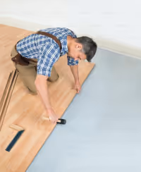 Person installing flooring
