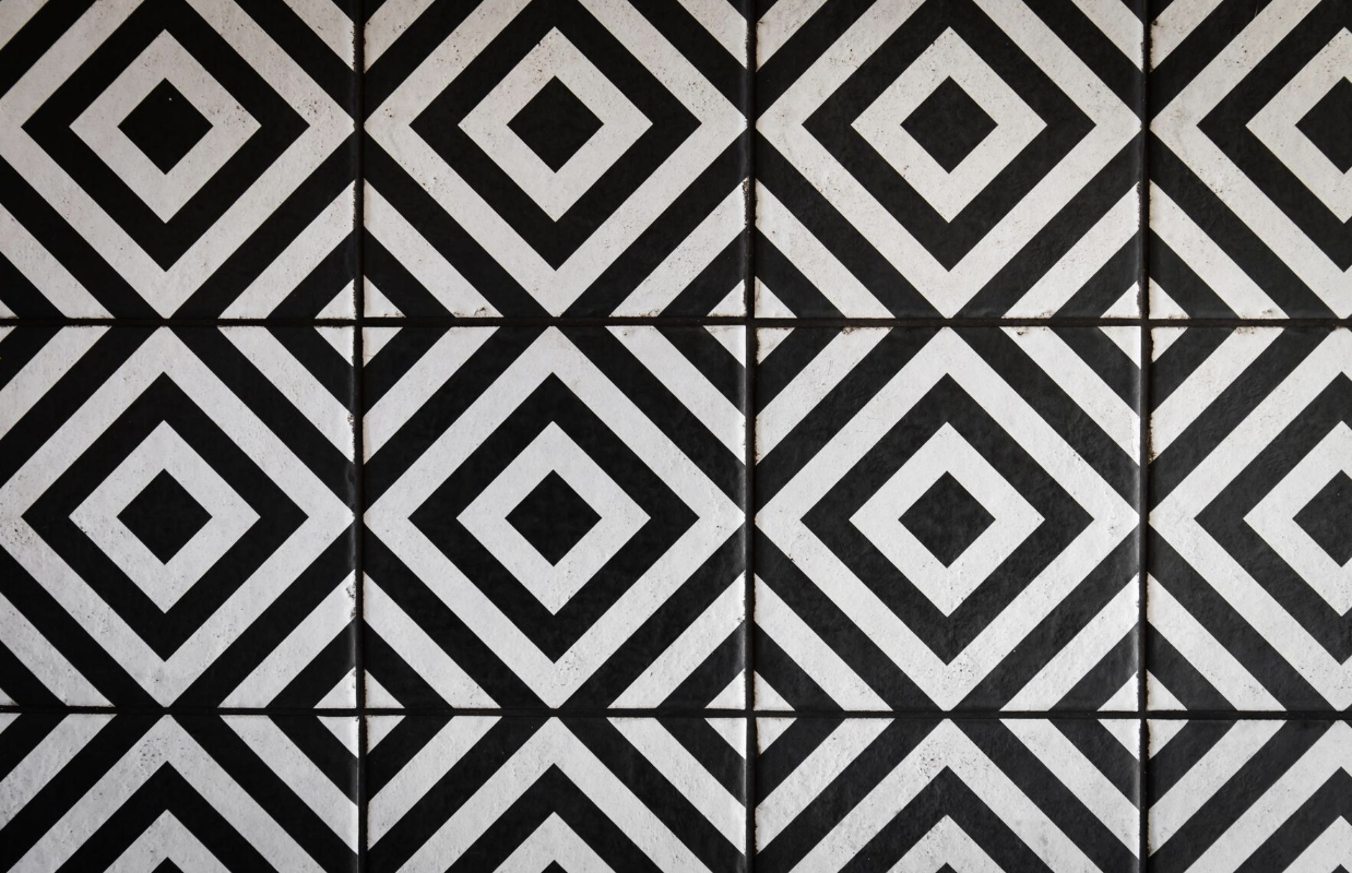 White and black geometric shower tiles with interesting patterns