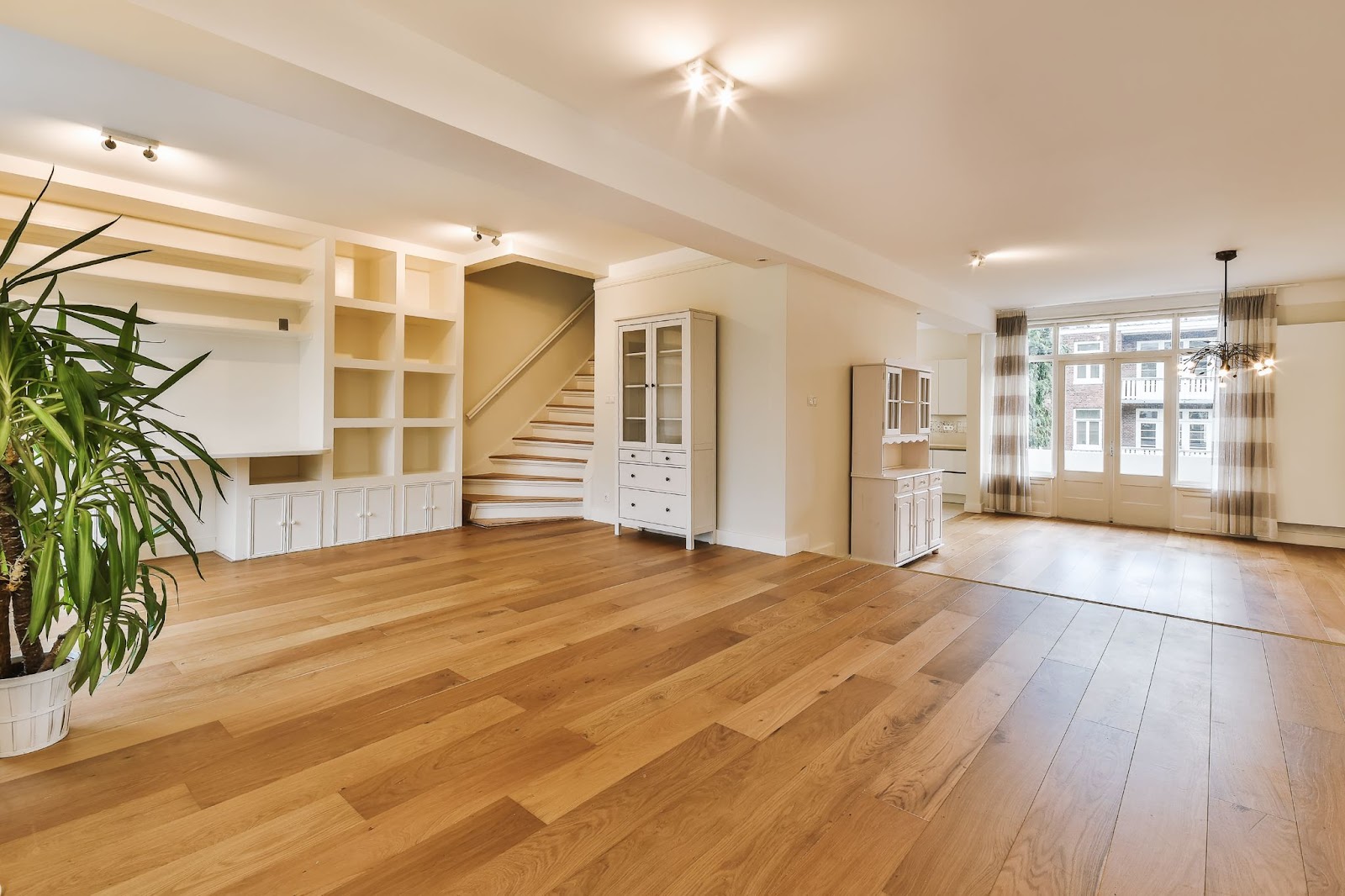 Home interior with light oak hardwood flooring and beige walls