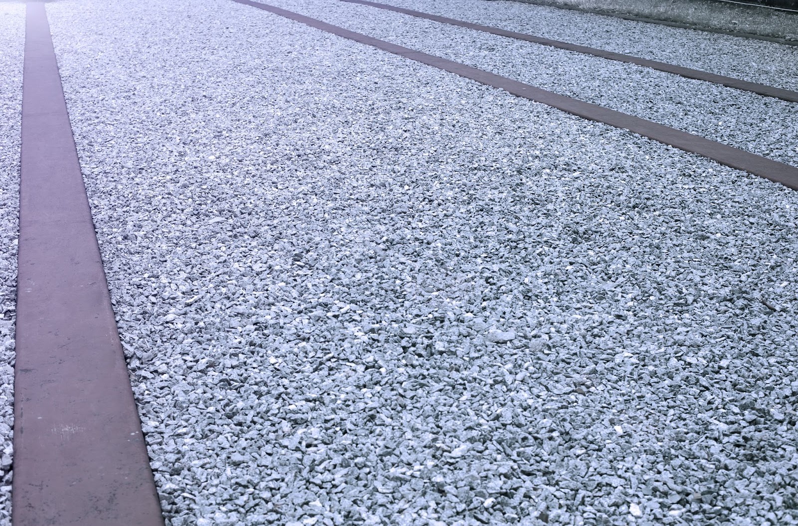 Close up of gravel and pear stone pavement