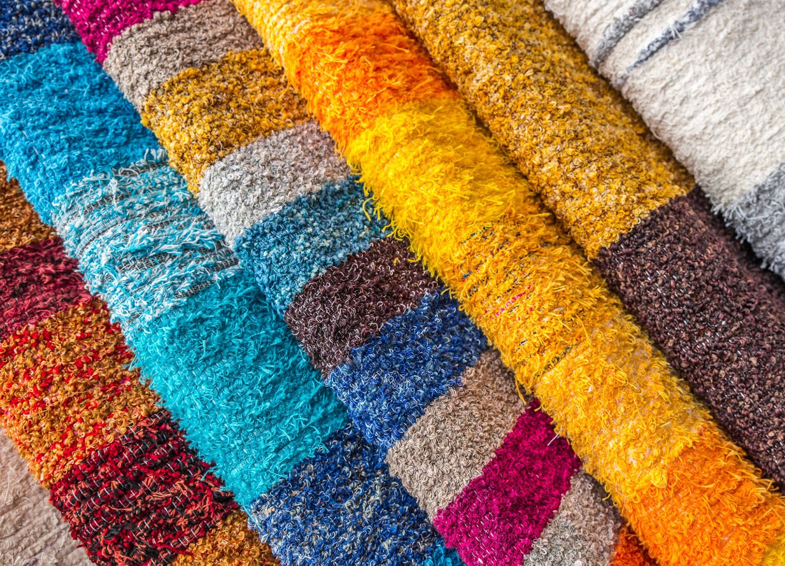 Synthetic and blended rugs