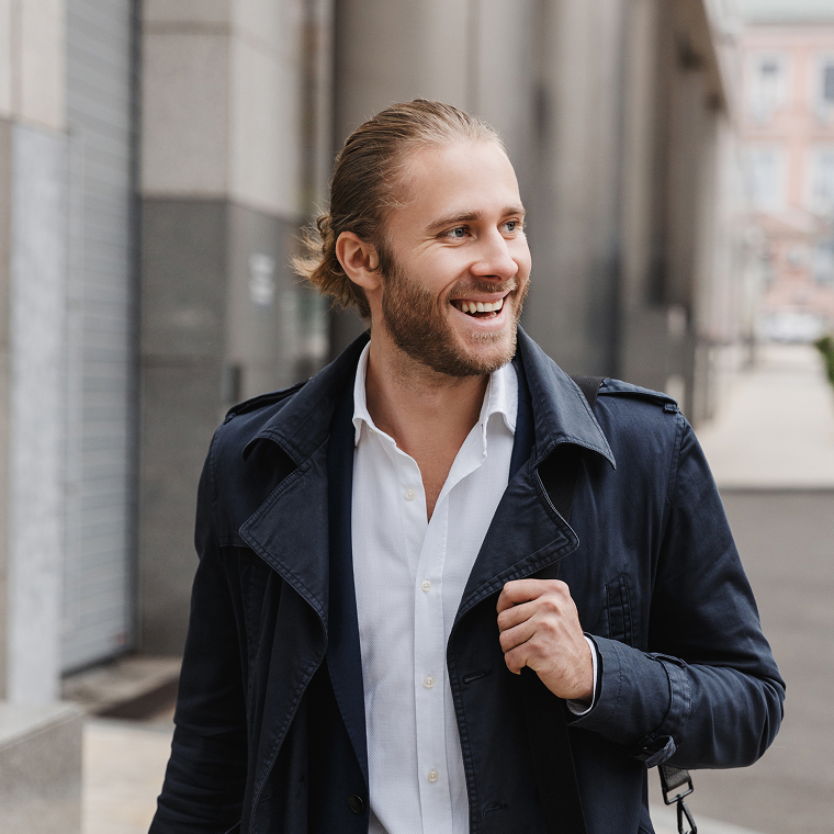 White male smilling at the distance