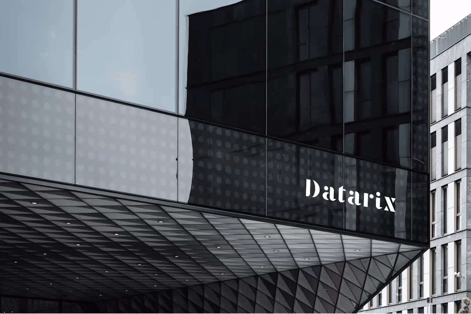 Datarix logo displayed on the glass façade of a building.
