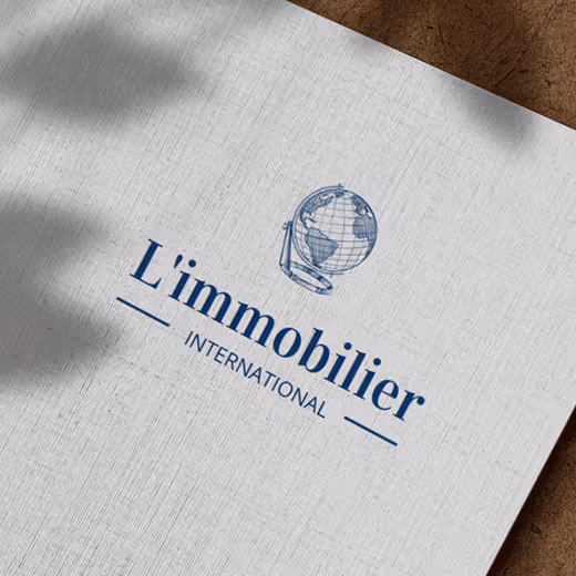 L’Immobilier International logo printed on paper.