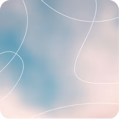 Layered blue mountains fading into the mist under a clear sky.