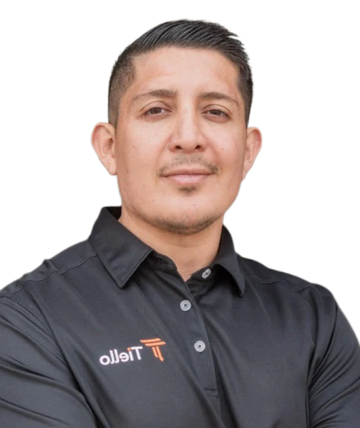 Dante Nino, Founder and Managing Partner at Tiello, wearing a black Tiello polo shirt.