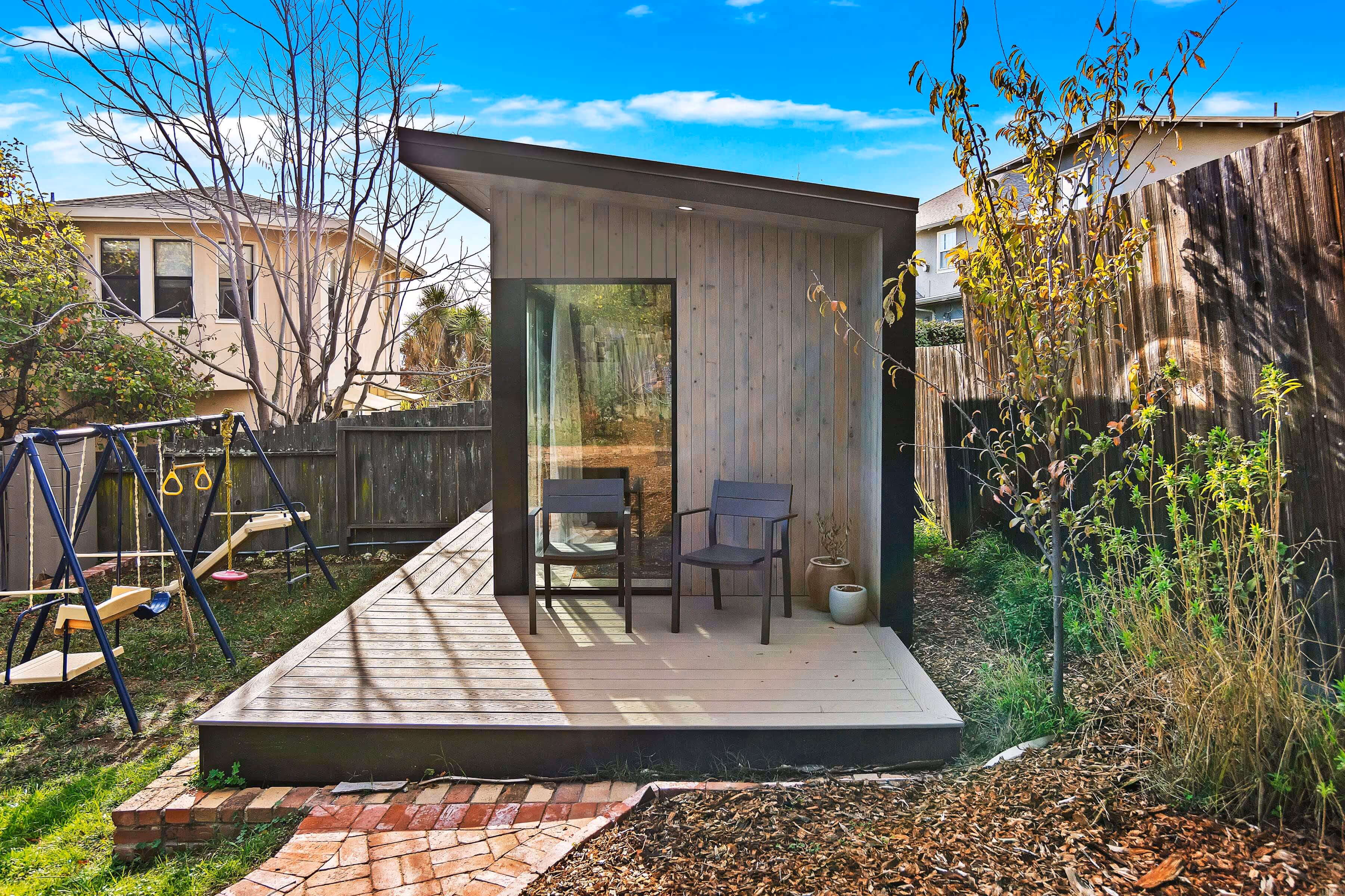Modern ADU with a deck in the yard.