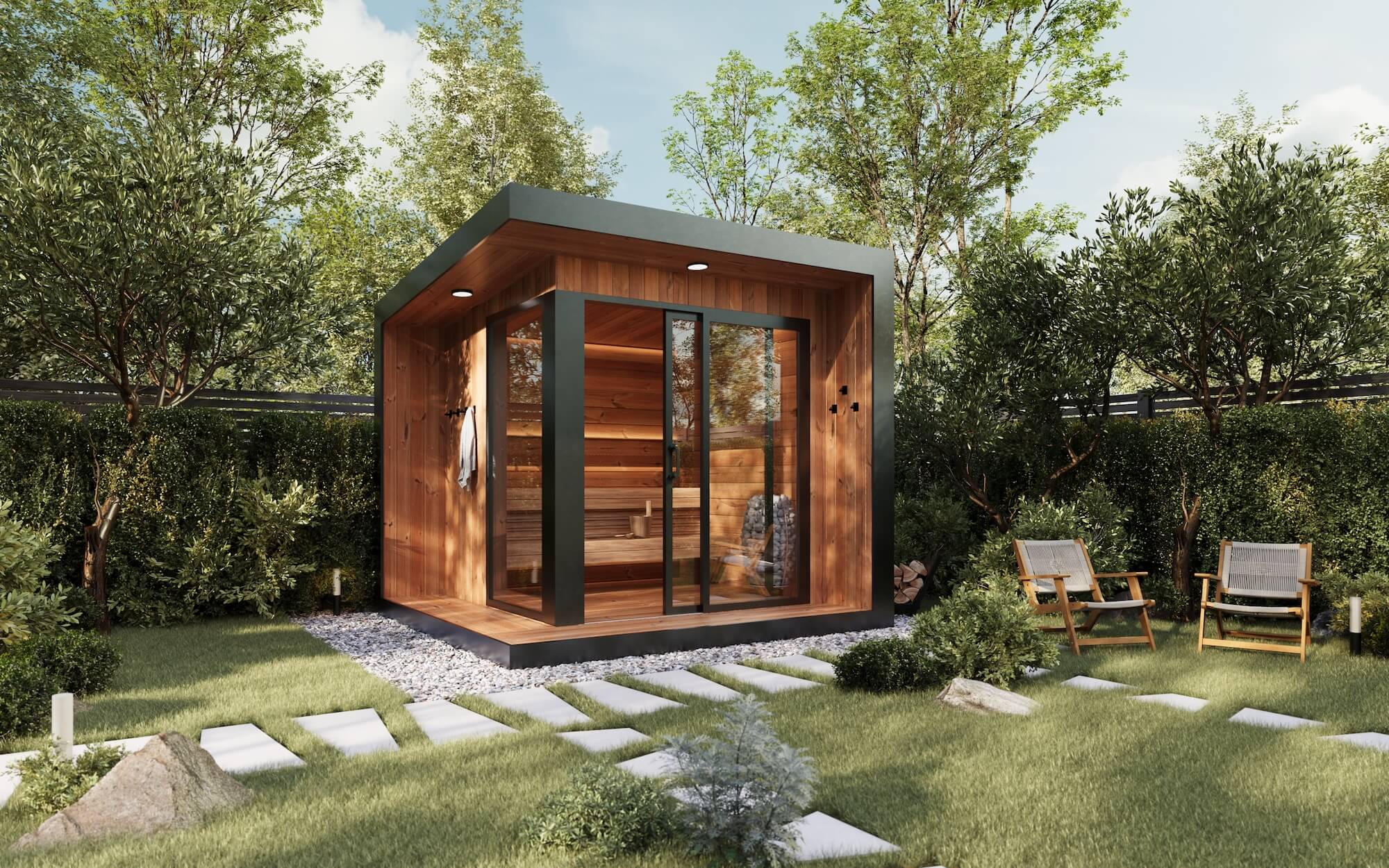 Modern wooden sauna cabin with glass doors in a lush green garden with stone path and two wooden chairs.